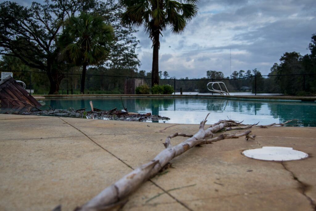 debris in swimming pool after hurricane